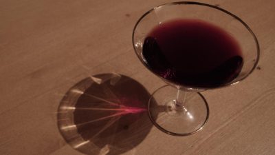Glass of red wine on a wooden table | Free Images For Commercial Use